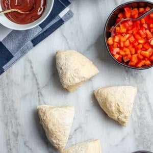 30 minute pizza crust recipe divided into 4 portions for a homemade pizza bar