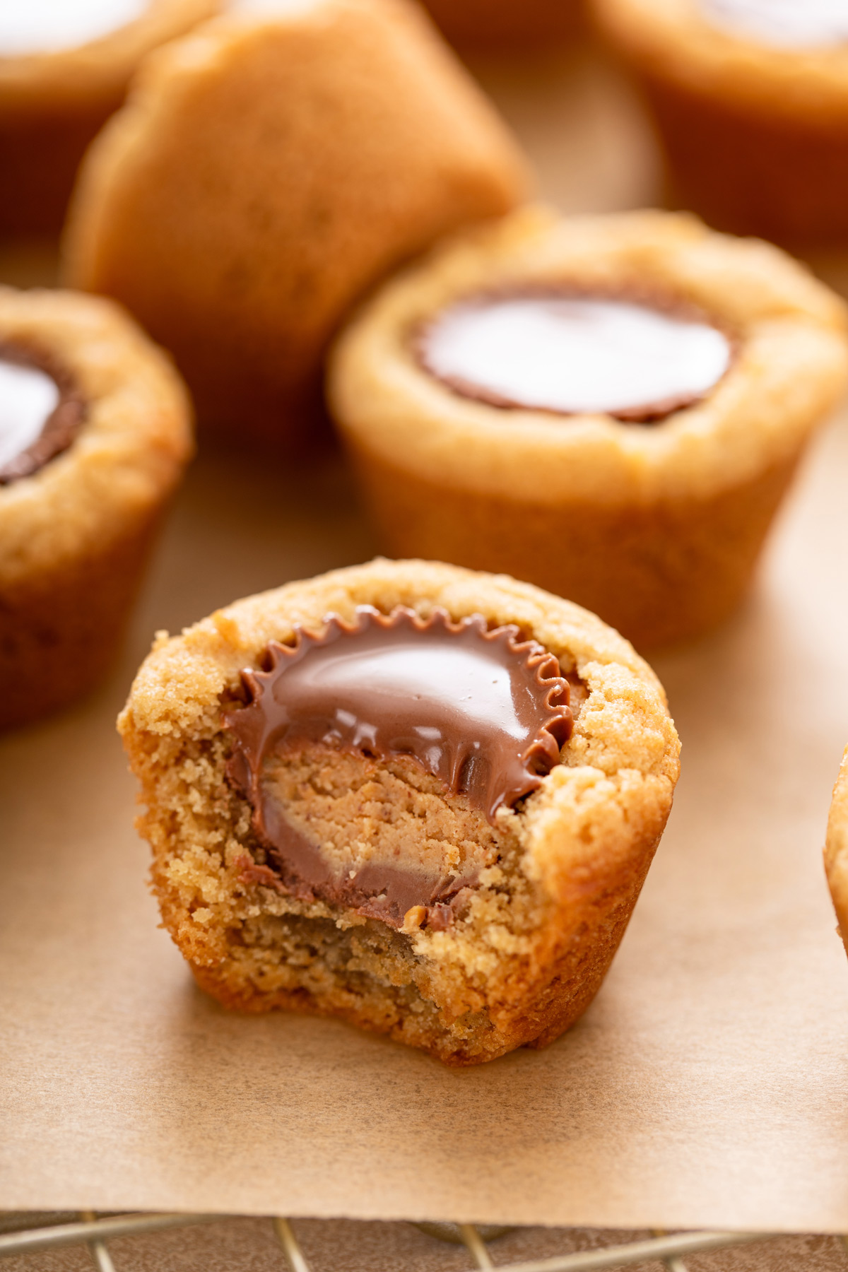 Bite from a peanut butter cup cookie, showing the peanut butter cup inside.