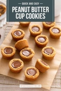 Peanut butter cup cookies arranged on a piece of parchment paper on top of a wire cooling rack. Text overlay includes recipe name.