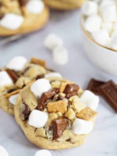 Close up of top of s'mores cookie with marshmallows, chocolate pieces and graham cracker cereal