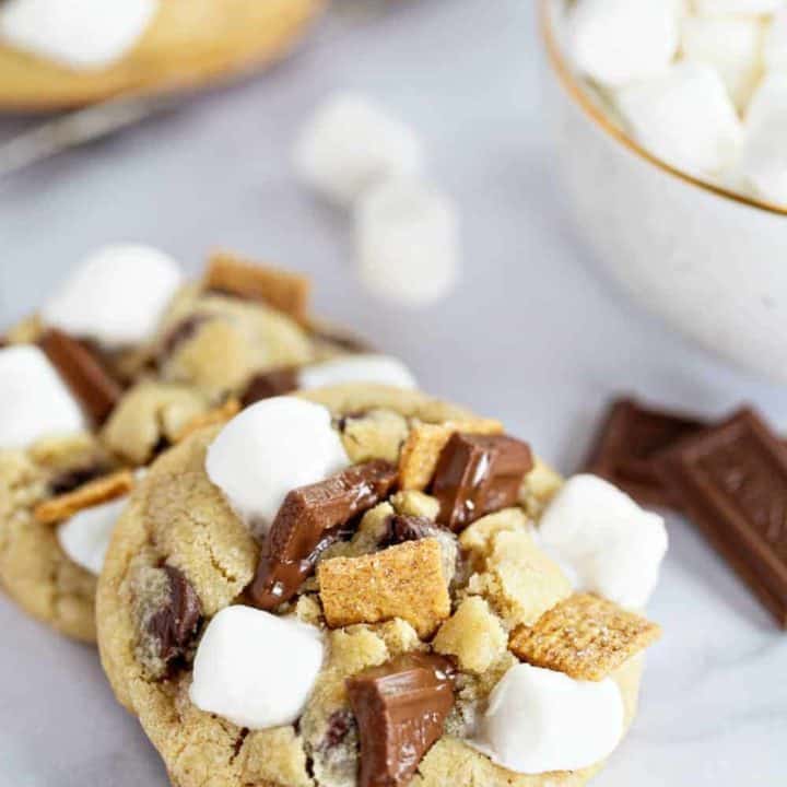 Close up of top of s'mores cookie with marshmallows, chocolate pieces and graham cracker cereal