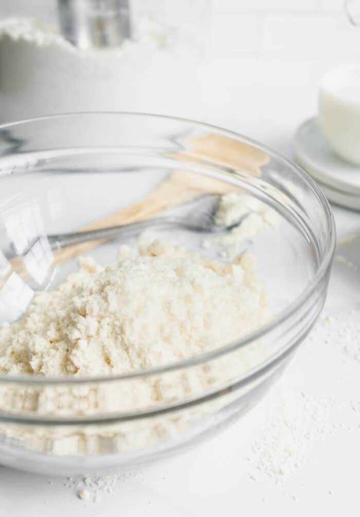 Bisquick mix in a glass mixing bowl on a counter, ready to make into Bisquick biscuits