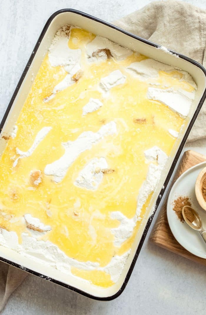 Easy peach cobbler in a baking pan, ready to go in the oven