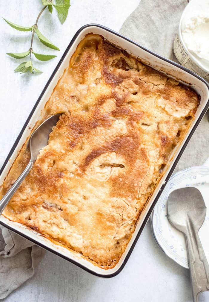 Easy peach cobbler fresh out of the oven on a counter