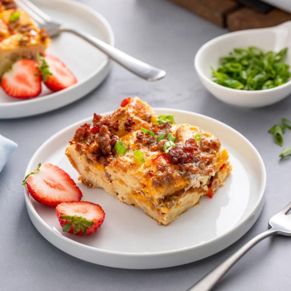 Slice of make-ahead breakfast casserole on a white plate.