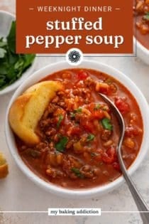 A slice of texas toast and a spoon in a white bowl of stuffed pepper soup. Text overlay includes recipe name.