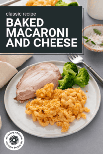 White plate holding slices of turkey and steamed broccoli next to a serving of baked macaroni and cheese. Text overlay includes recipe name.