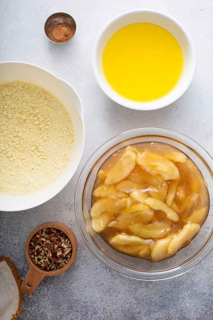 Ingredients for apple dump cake arranged on a gray counter