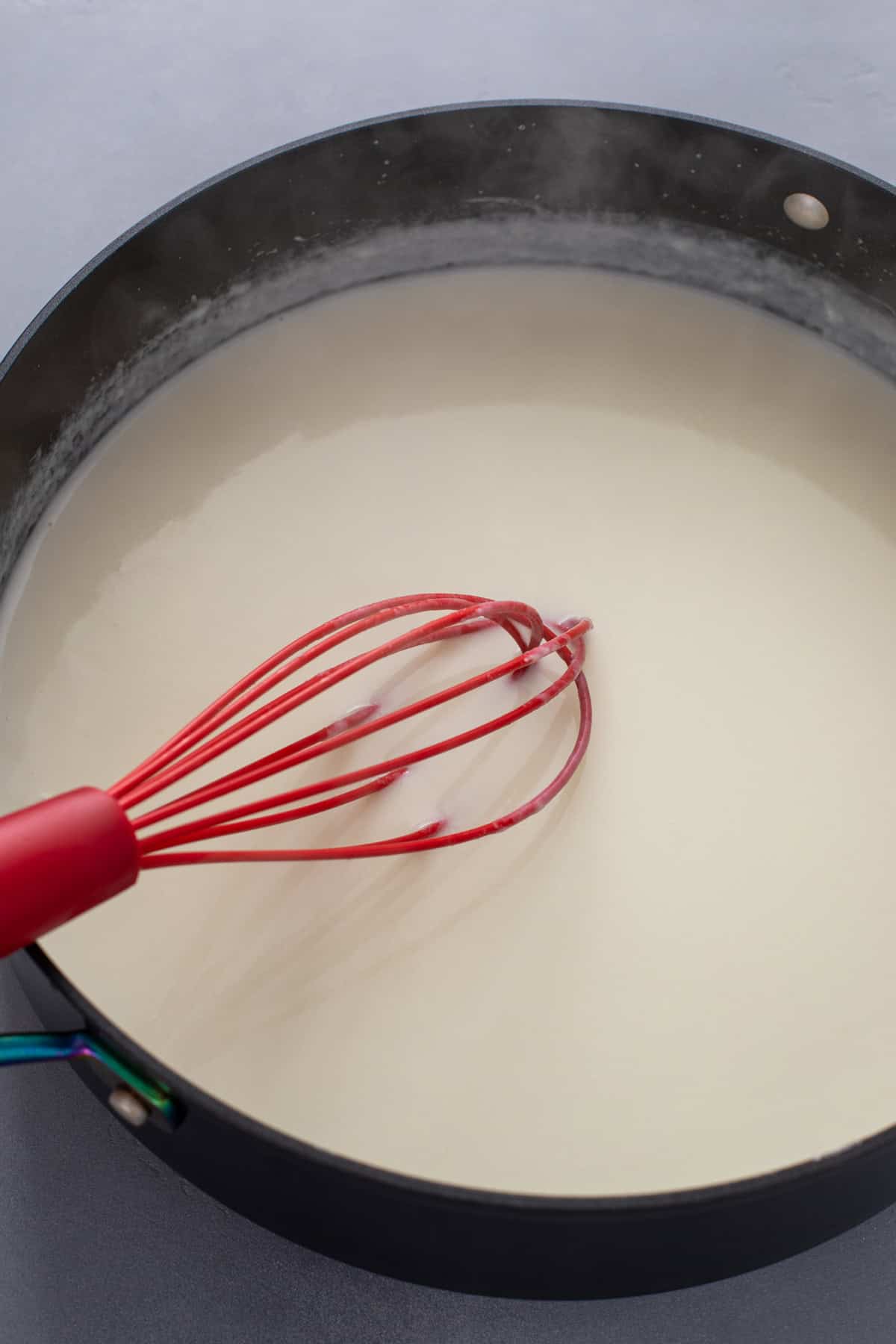 Base for a cheese sauce in a skillet.