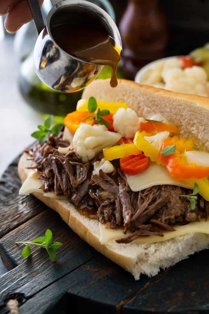 Assembled italian beef sandwich on a wooden board