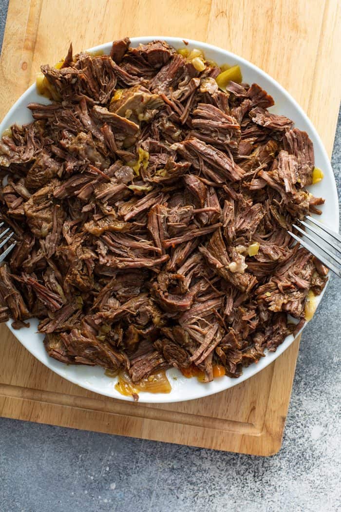 Shredded italian beef on a white plate