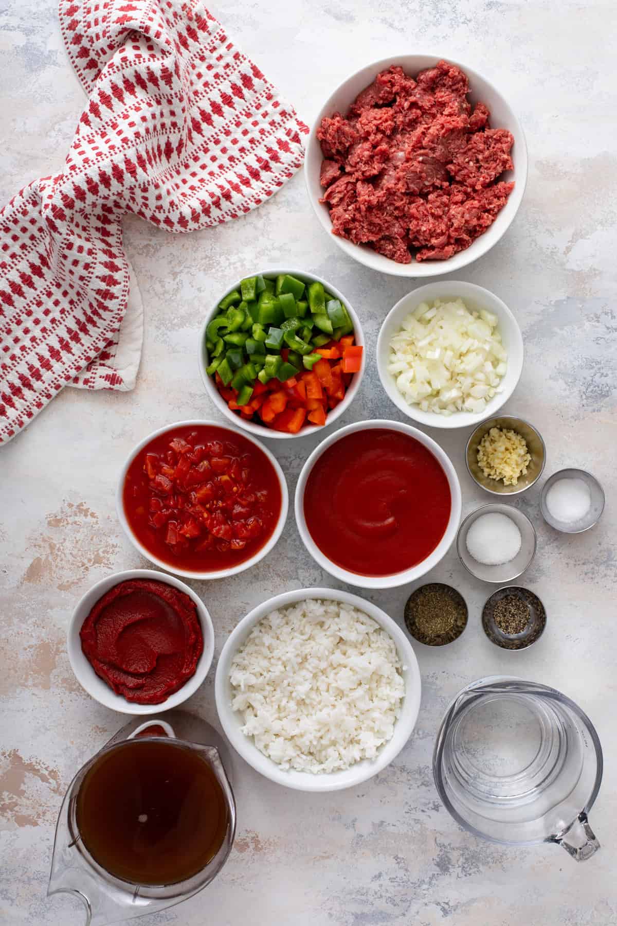Ingredients for stuffed pepper soup arranged on a countertop.