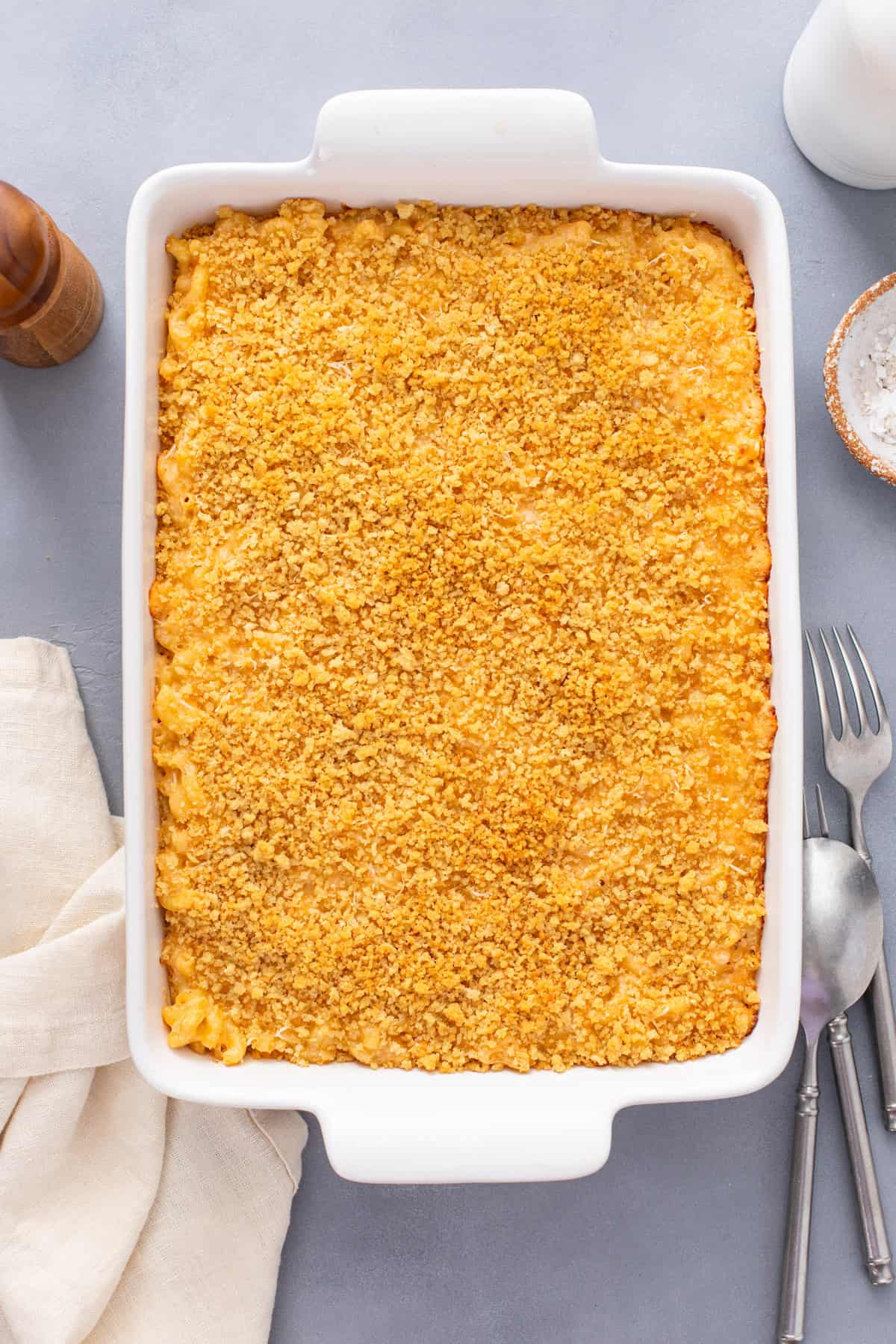 Assembled mac and cheese in a white skillet, ready to go in the oven.