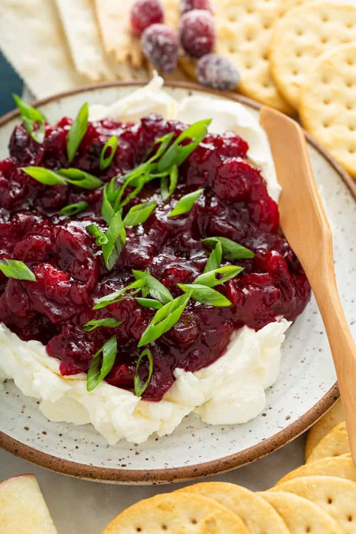 Close up of cranberry cream cheese dip on a plate