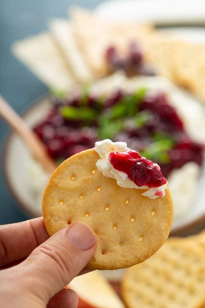 Cranberry cream cheese dip on a cracker