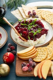 Cranberry cream cheese dip with a wooden serving knife
