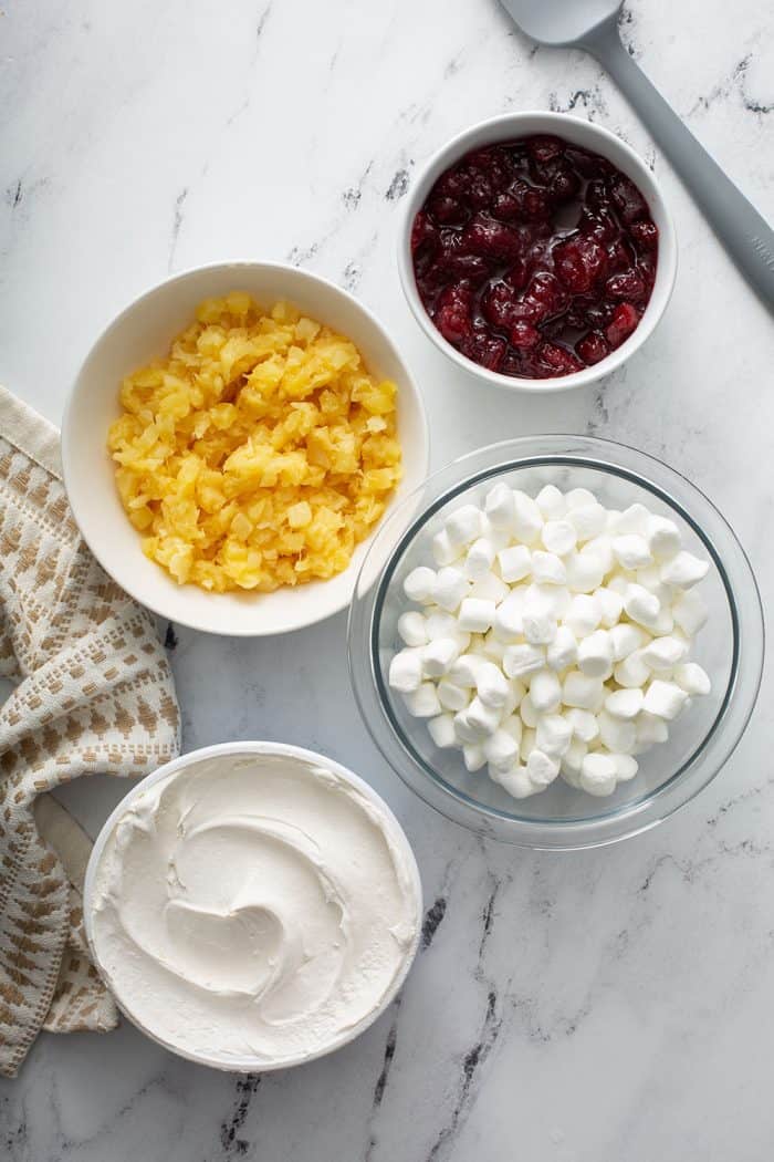 Ingredients for cranberry fluff on a marble counter