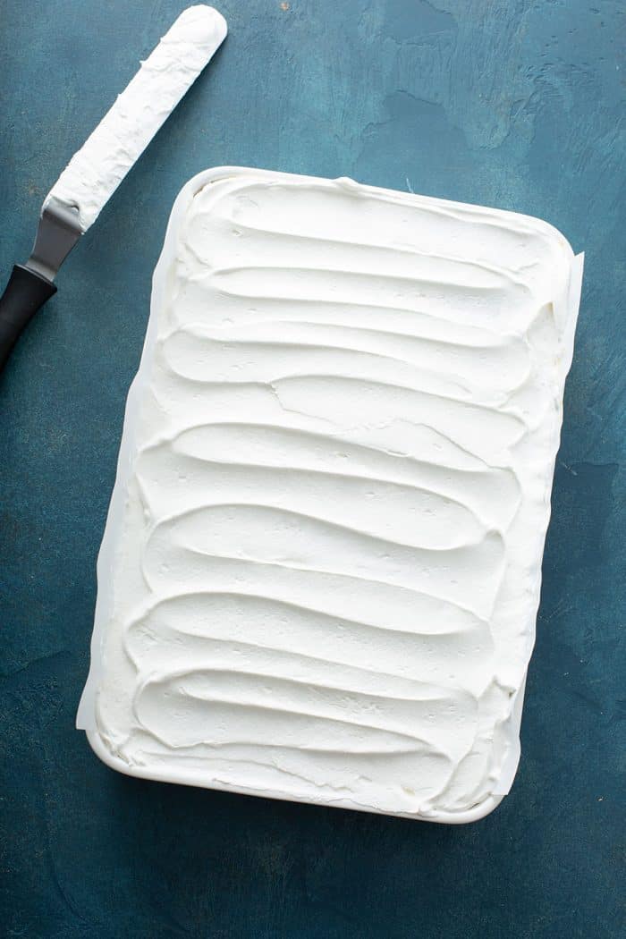 Whipped topping spread evenly in a cake pan