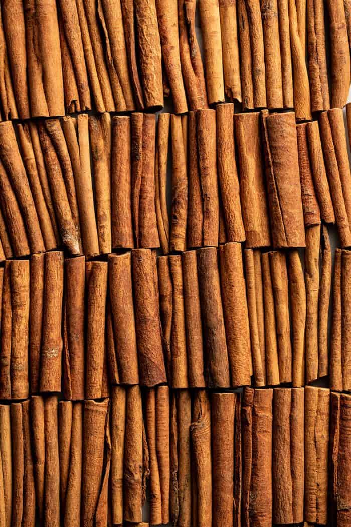 Cinnamon sticks laid out on a countertop