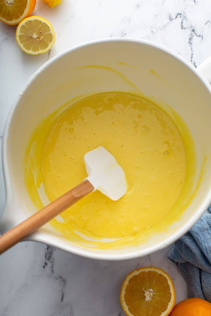 Citrus cake batter in a white mixing bowl