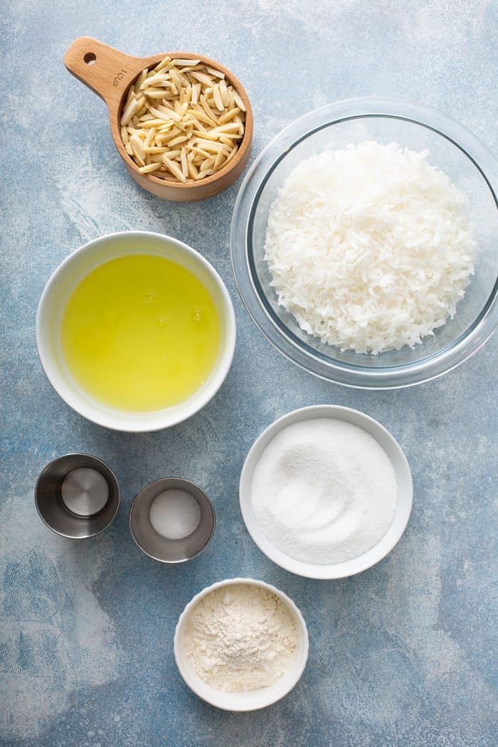 Ingredients for coconut macaroons on a blue countertop