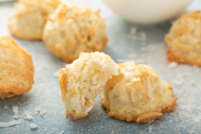 Coconut macaroons scattered on a countertop