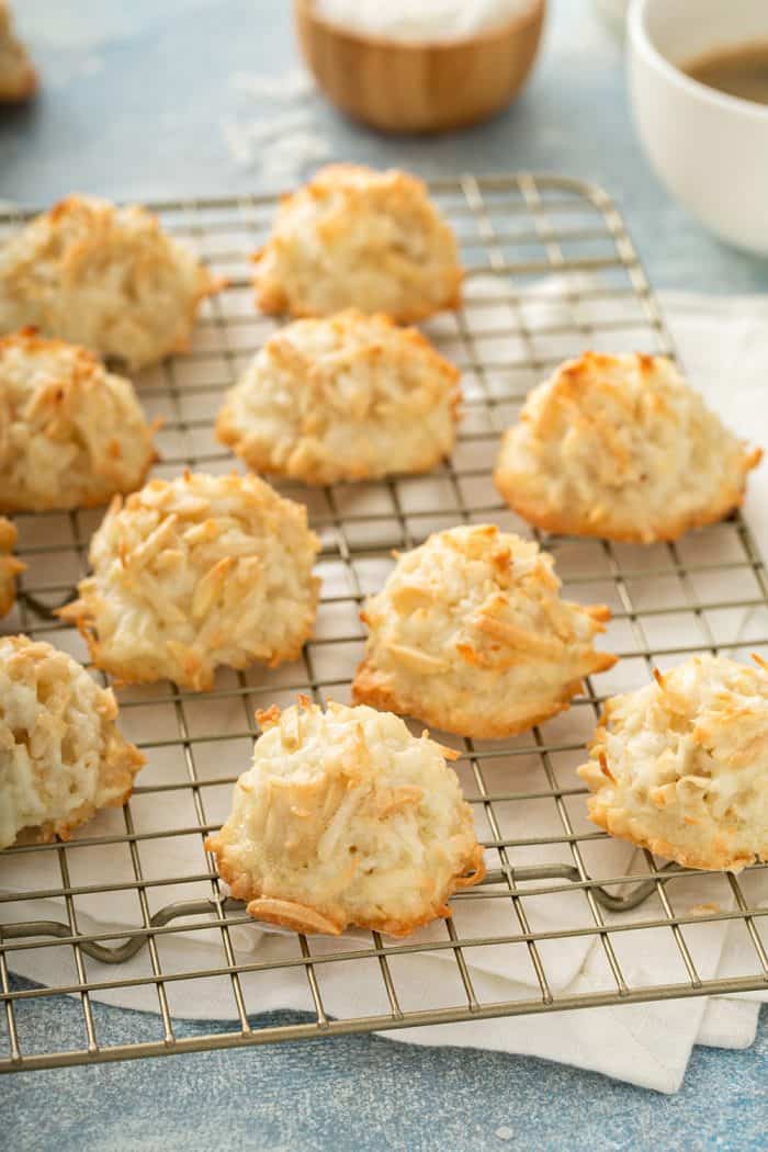 Baked coconut macaroons on a metal cooling rack