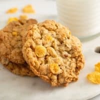 Cornflake cookies stacked on a marble platter
