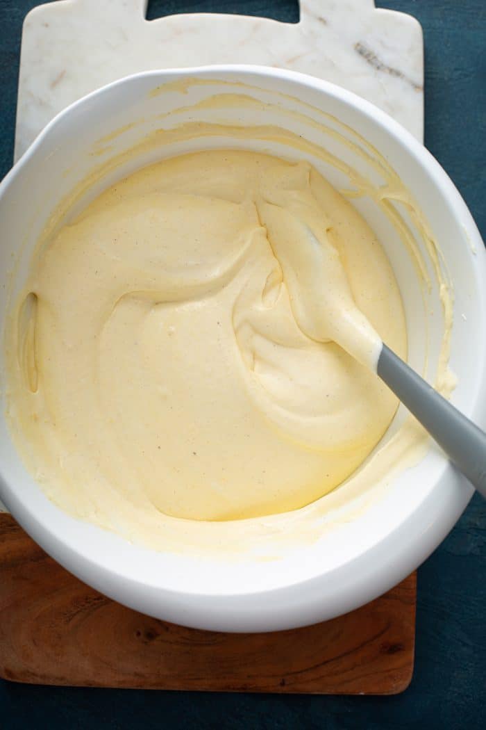 Eggnog eclair cake filling in a white mixing bowl