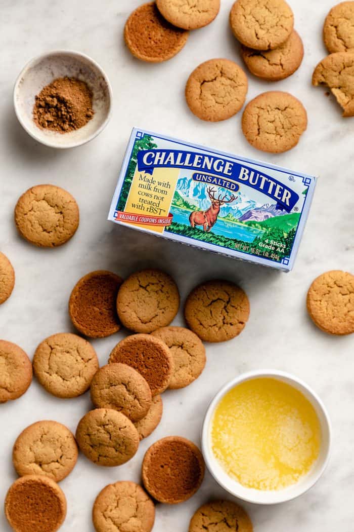 Ingredients for gingersnap cookie crust on a marble counter