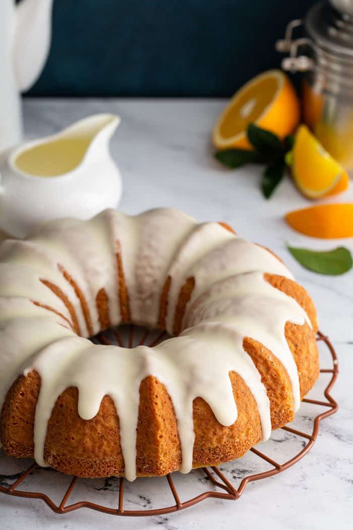 Glazed citrus bundt cake on a marble counter