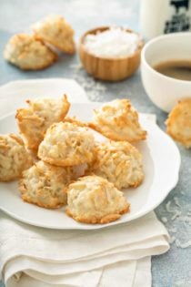 Coconut and almond macaroons arranged on a white plate