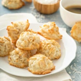 Coconut and almond macaroons arranged on a white plate