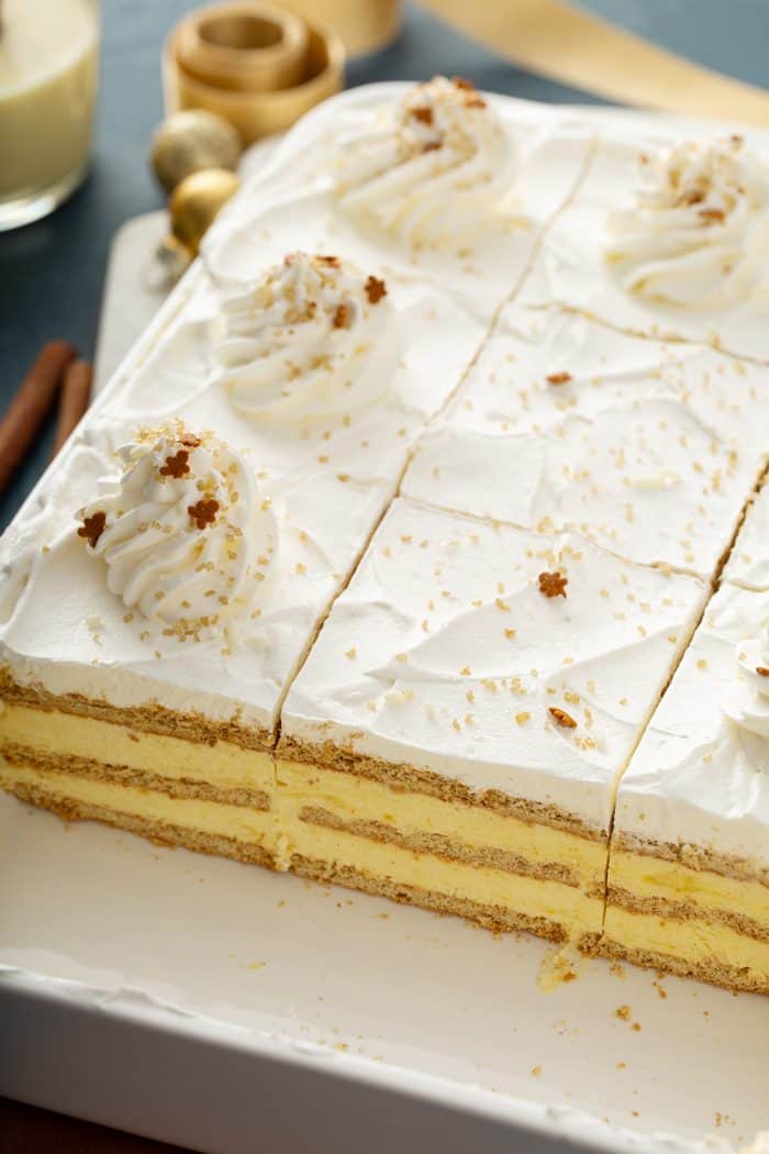 Sliced eclair cake in a white cake pan, showing the layers of the eclair cake