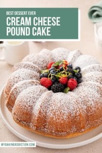 Cream cheese pound cake dusted with powdered sugar and topped with fresh berries. Text overlay includes recipe name.