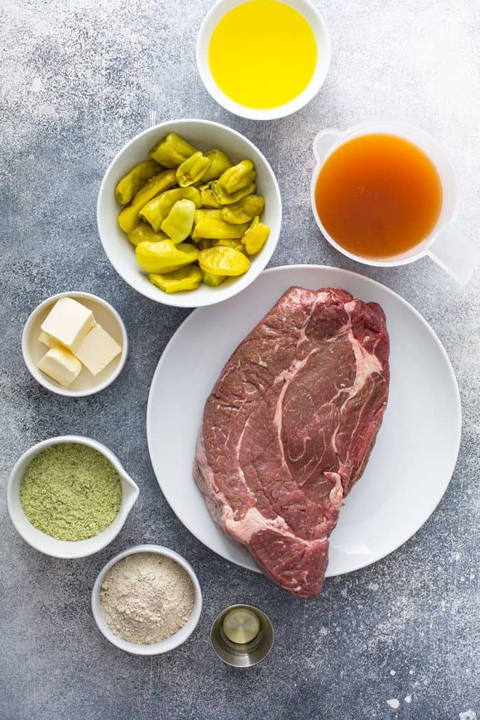 Ingredients for Mississippi pot roast arranged on a gray counter