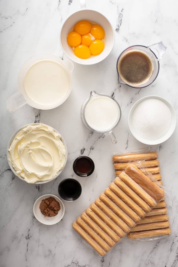 Tiramisu ingredients on a marble countertop