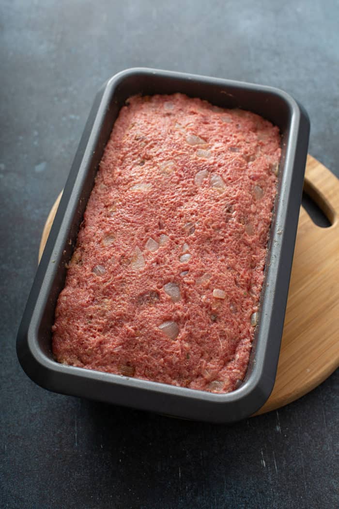 Meatloaf mix in a loaf pan, ready to be baked