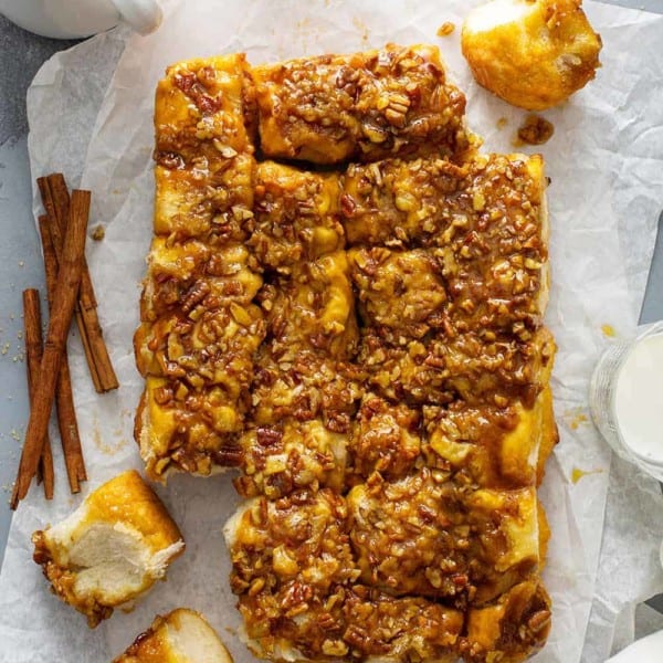 Pecan sticky buns on a sheet of parchment paper