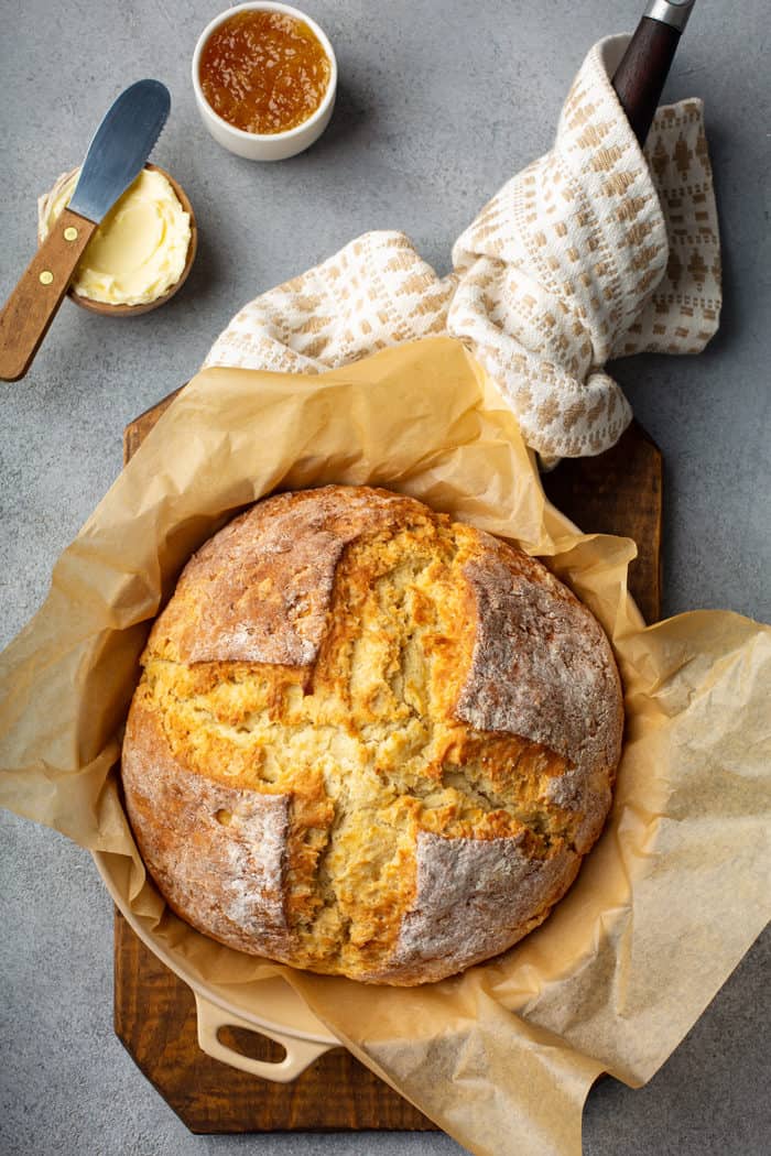 Baked loaf of irish soda bread in a cast iron skillet