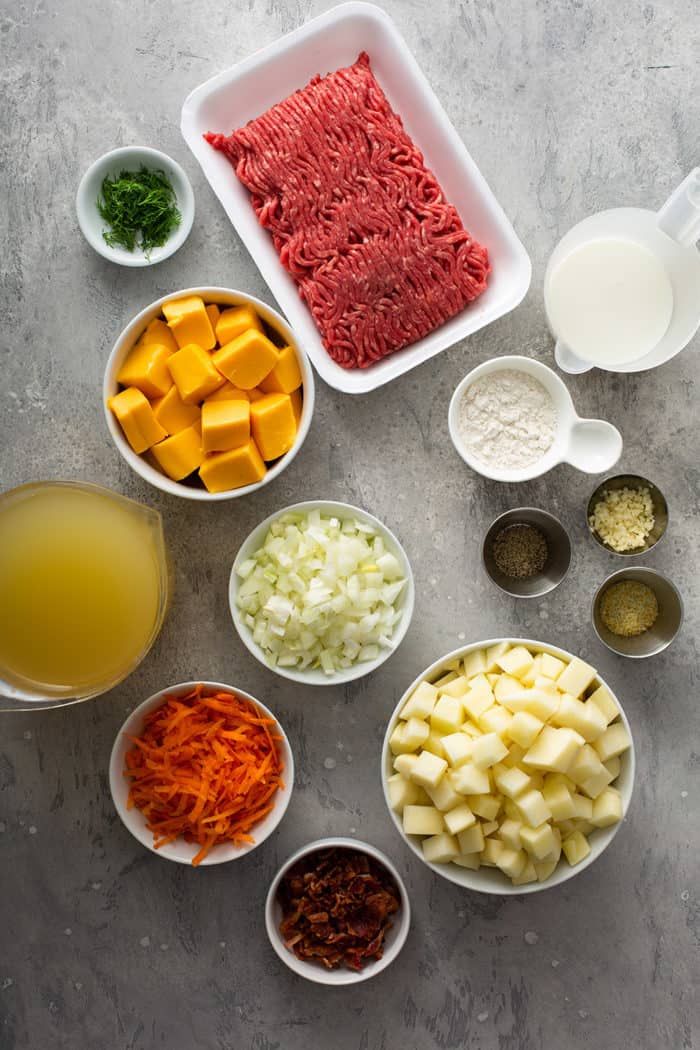 Cheeseburger soup ingredients on a gray counter