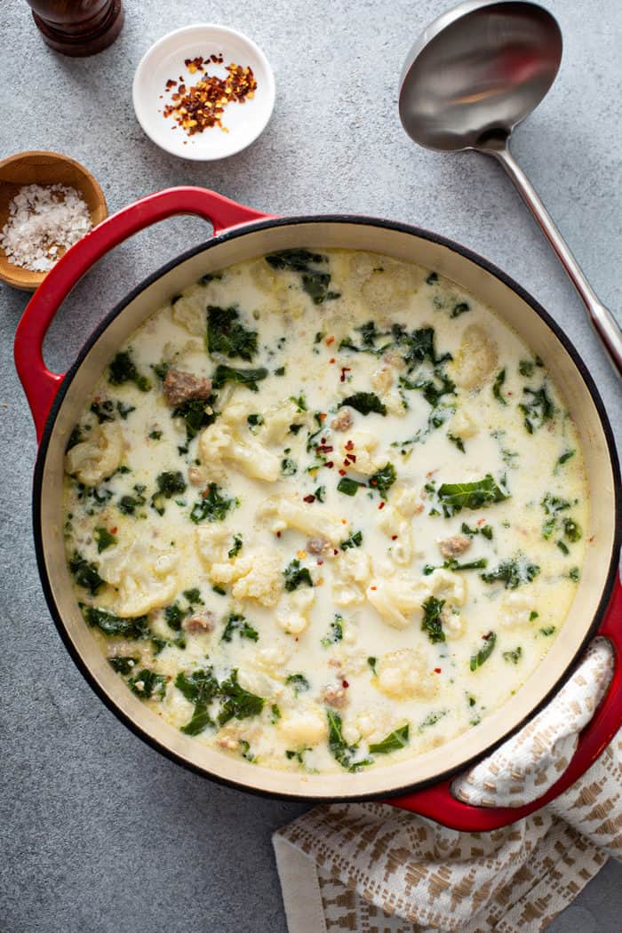Overhead view of low carb zuppa toscana in a large red dutch oven