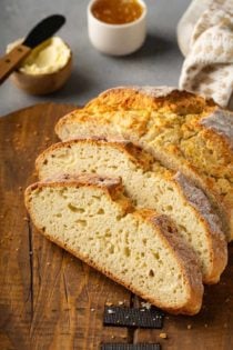 Slices of irish soda bread arranged on a wooden cutting board