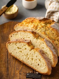 Slices of irish soda bread arranged on a wooden cutting board