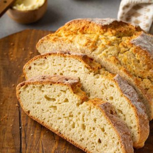 Slices of irish soda bread arranged on a wooden cutting board