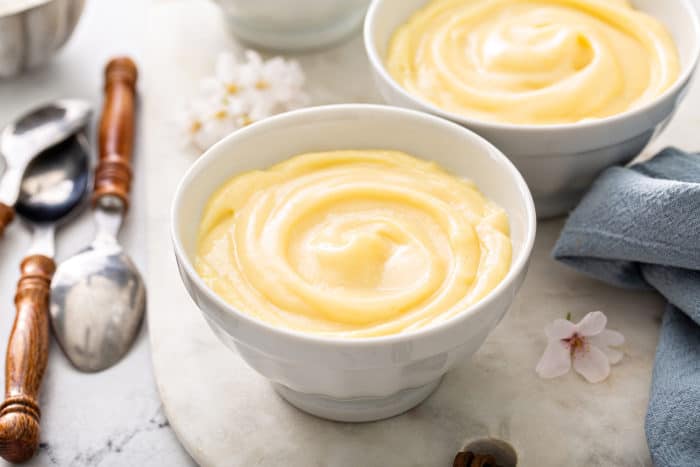 Close up of homemade vanilla pudding in a small white bowl