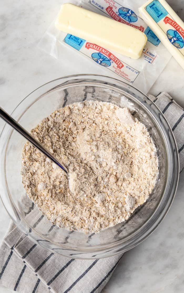 Dry ingredients for berry crisp topping mixed together in a glass mixing bowl