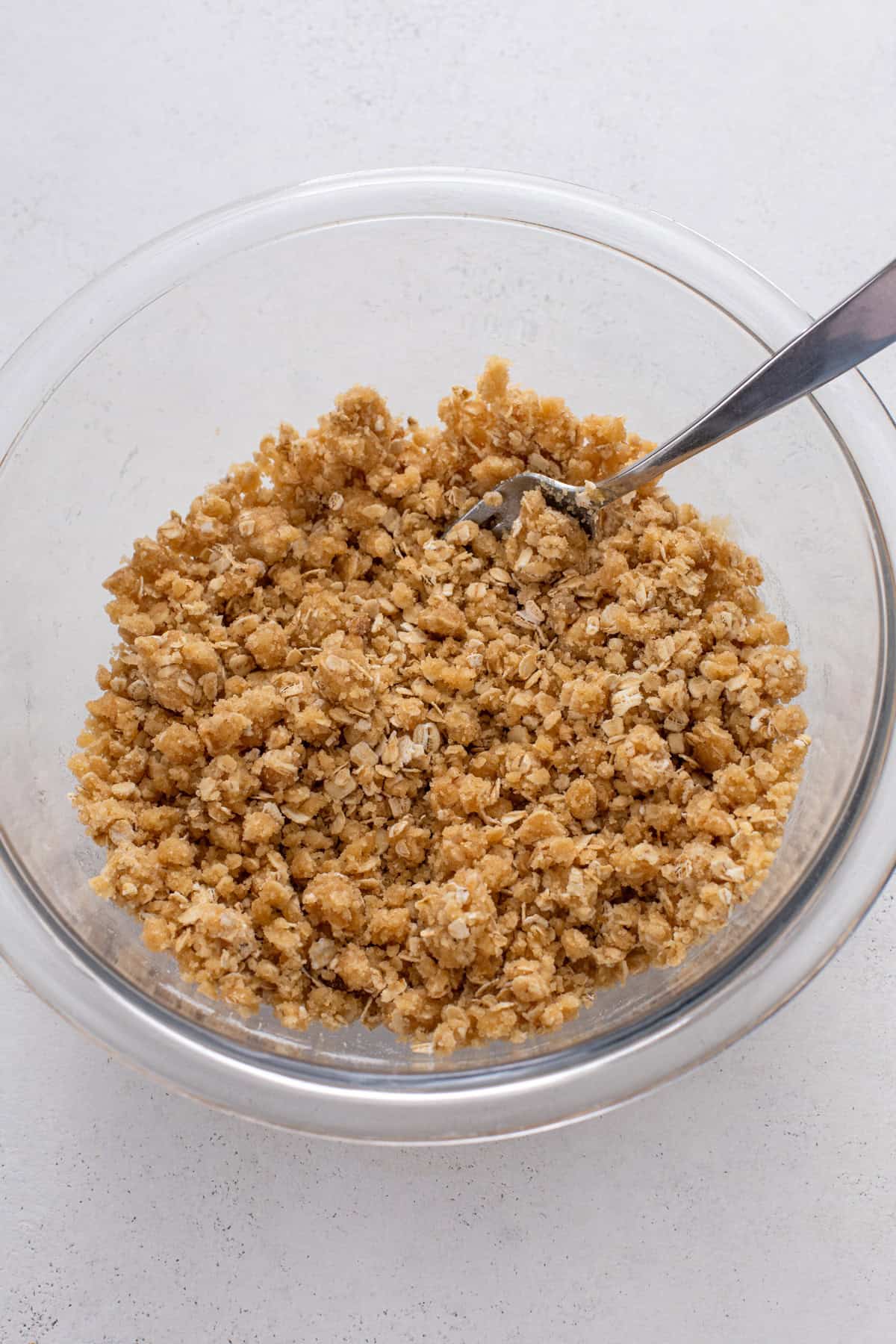 Crisp streusel topping mixed in a glass bowl.