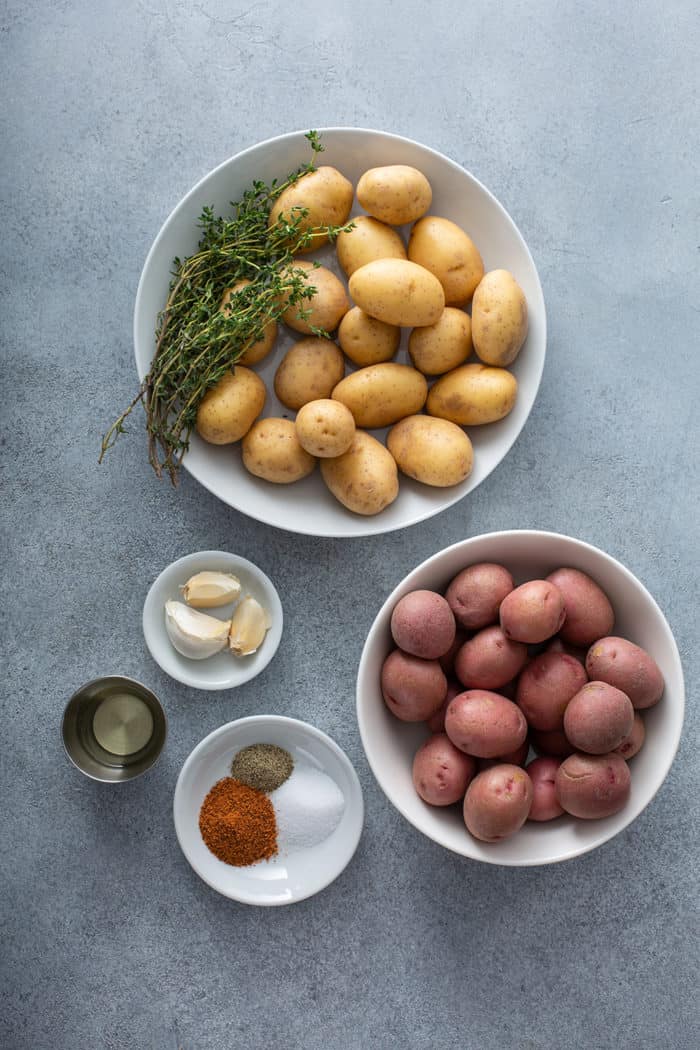 Ingredients for air fryer roasted potatoes on a gray countertop