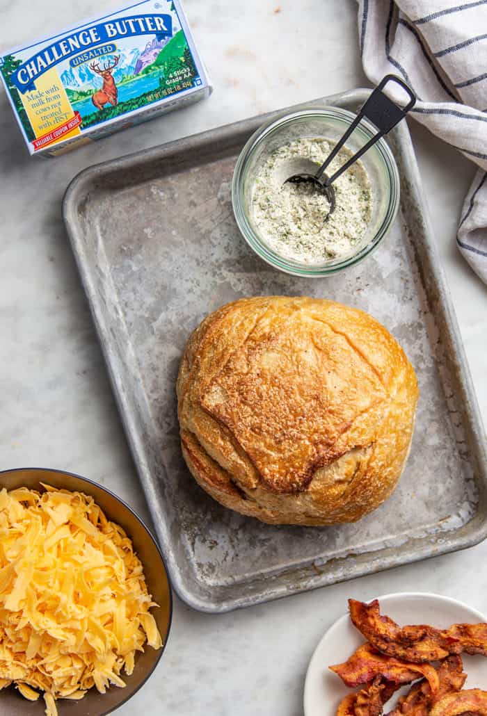 Ingredients for cheesy ranch pull-apart bread arranged on a countertop